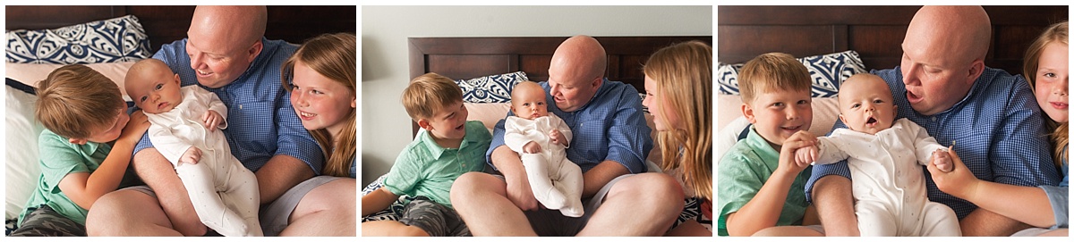 Father and 3 kids on bed during newborn photo session