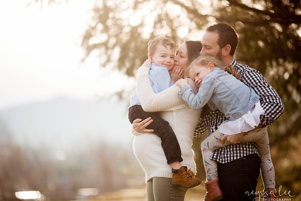 Family in Snoqualmie during maternity portrait session, Mother holding son and father holding daugther