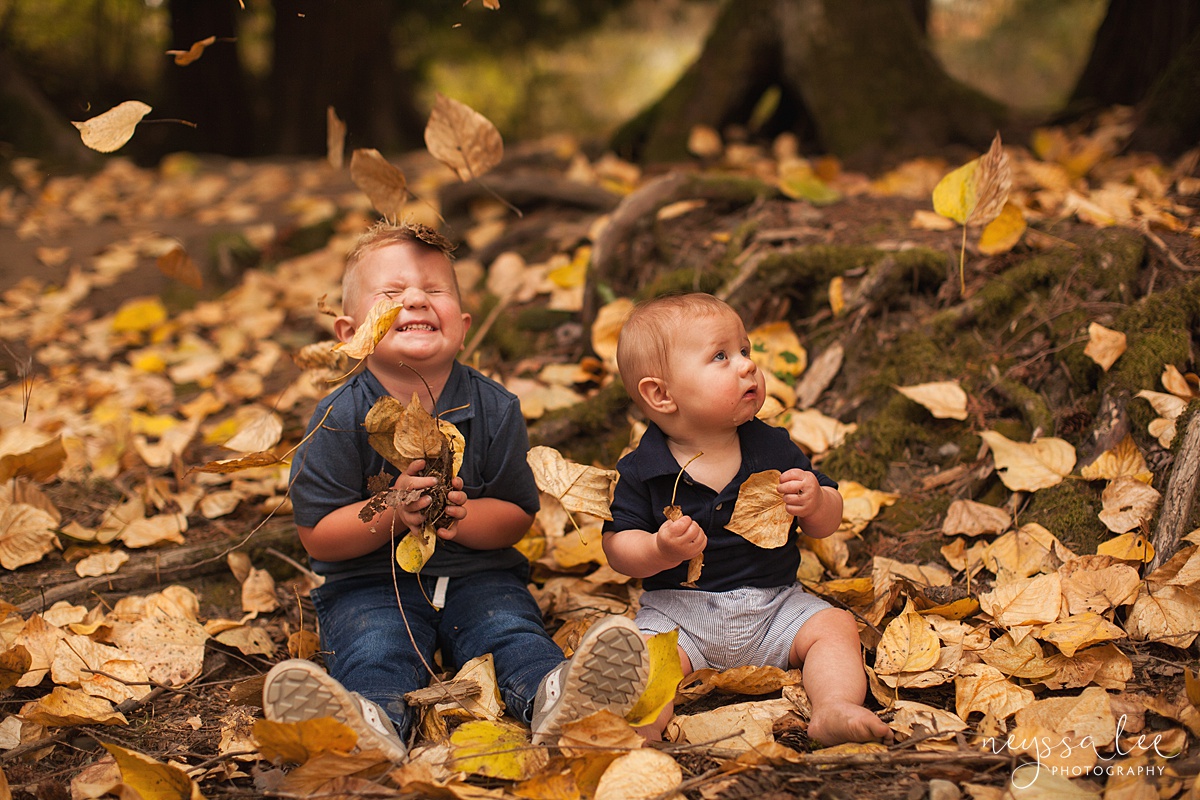 Snoqualmie family photographer, Neyssa Lee Photography, toddler only wants to play during photos, brothers in leaves together