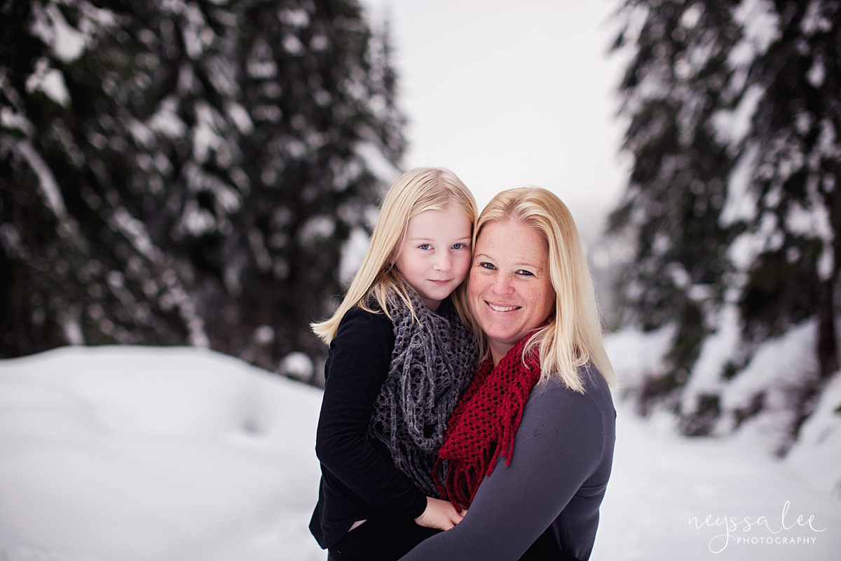 Mother and daughter portrait in snow at Sonqualmie Pass