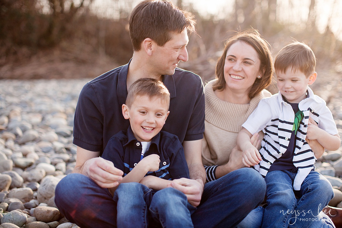 Family Photos by the River at Sunset, Neyssa Lee Photography, Snoqualmie Family Photography, Family of Four, Mom and dad smiling at each other