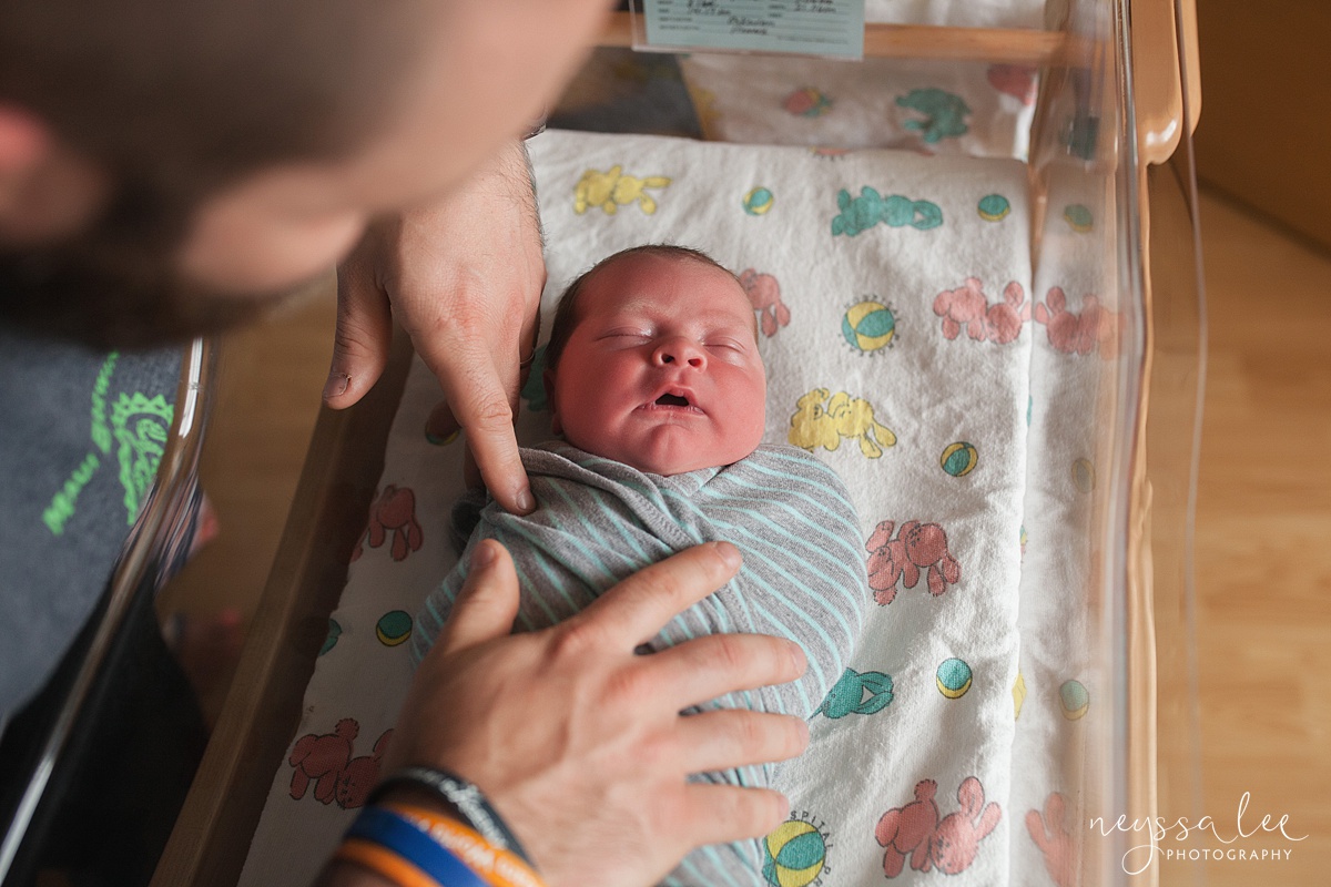 unsure of fresh 48 photos, issaquah fresh 48 photographer, Neyssa Lee Photography, Father calms Newborn Son