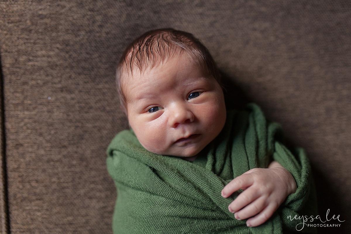 Neyssa Lee Photography, Awake newborn baby boy, lifestyle newborn photography, Seattle newborn photographer, swaddled baby boy making eye contact