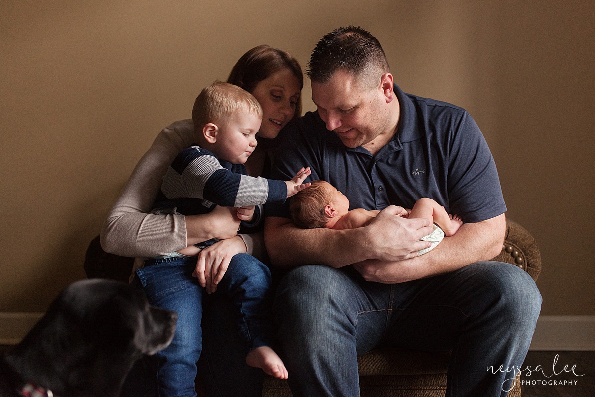 Family with toddler and newborn baby