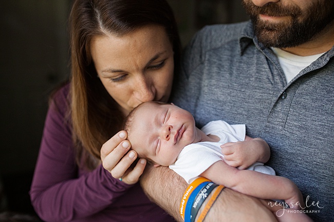 Seattle Newborn Photography, Neyssa Lee Photography, Snoqualmie photographer, mom tenderly gives baby boy a kiss