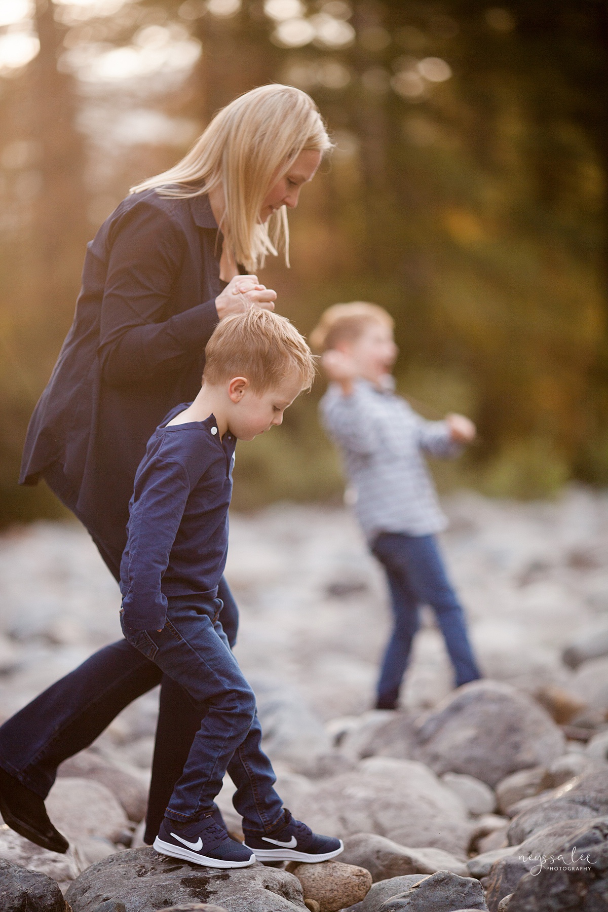 Snoqualmie Family Photographer, Neyssa Lee Photography, Fall Family Photos, Change of perspective on family photos, Mother and son walking on river rocks