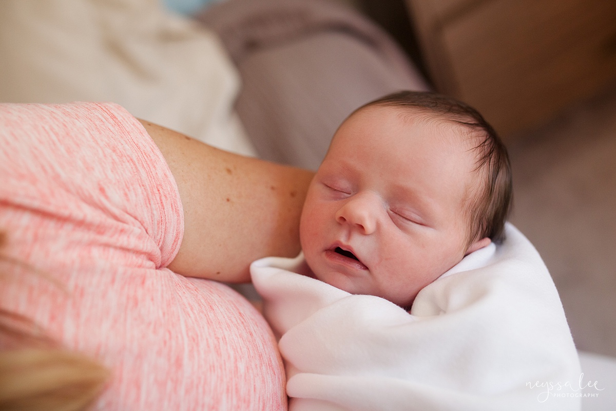 When should I book newborn photos, Neyssa Lee Photography, Seattle Newborn Photographer, Lifestyle newborn photography, Swaddled newborn baby asleep in moms arms