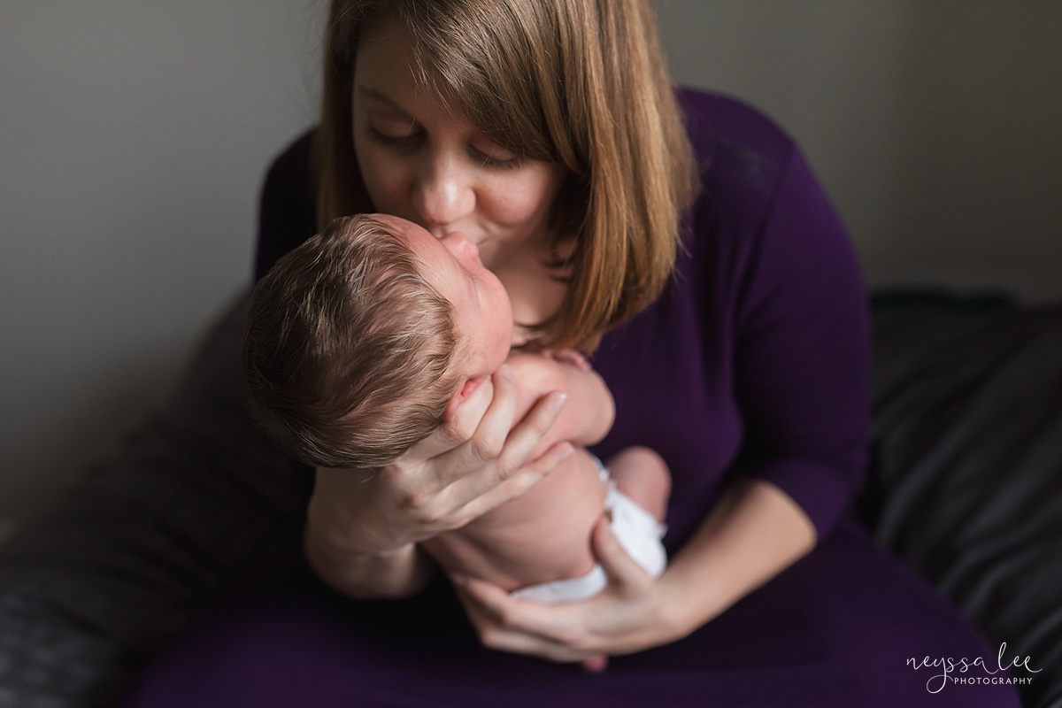 Seattle newborn photographer, Neyssa Lee Photography, Lifestyle Newborn Photography, photo of mom kissing newborn baby girl