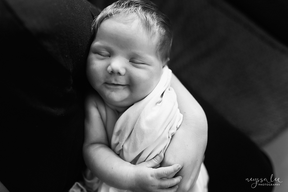 Seattle newborn photographer, Neyssa Lee Photography, Lifestyle Newborn Photography, black and white photo of newborn baby smile