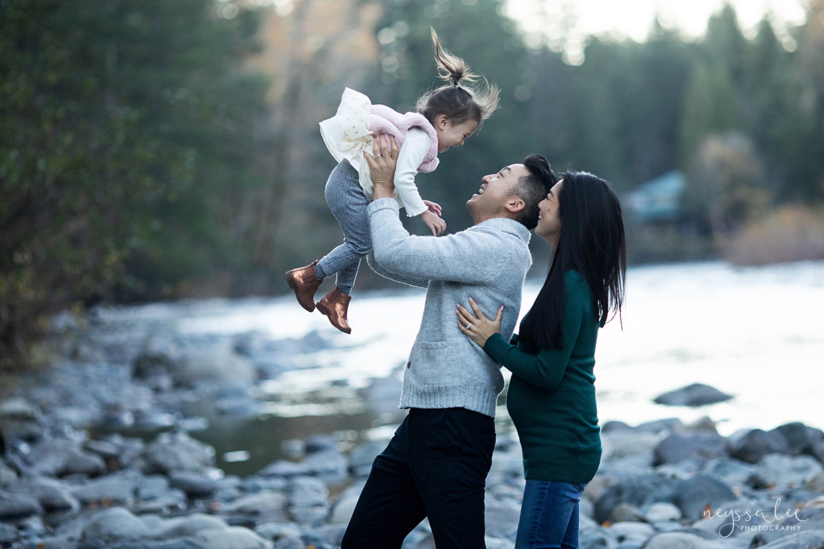Neyssa Lee Photography, Seattle Lifestyle Family Photographer,  Photo of dad tossing daughter into the air with mom smiling nearby
