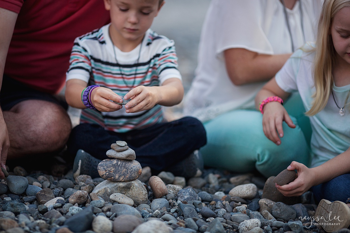 Photo of boy building rock tower during Snoqualmie portrait session