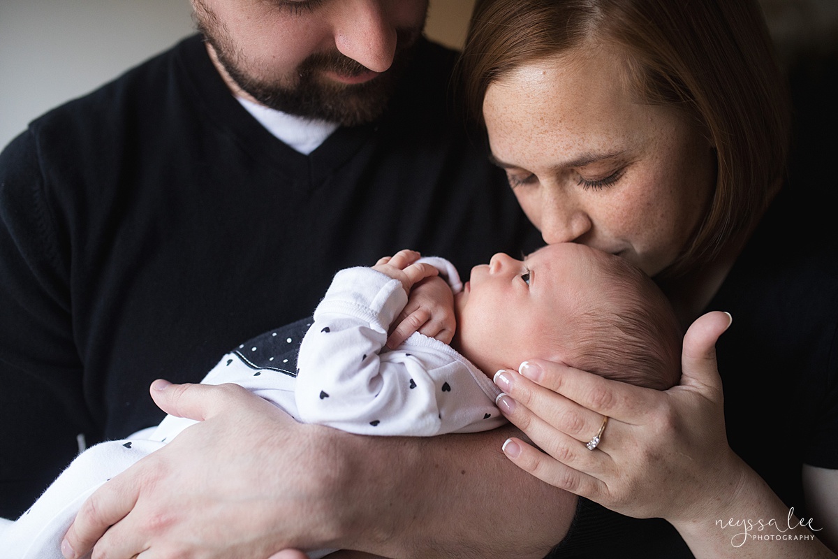 Neyssa Lee Photography, Seattle Newborn Photographer,  Newborn Photo Session Experience, lifestyle newborn photo with mom kissing baby