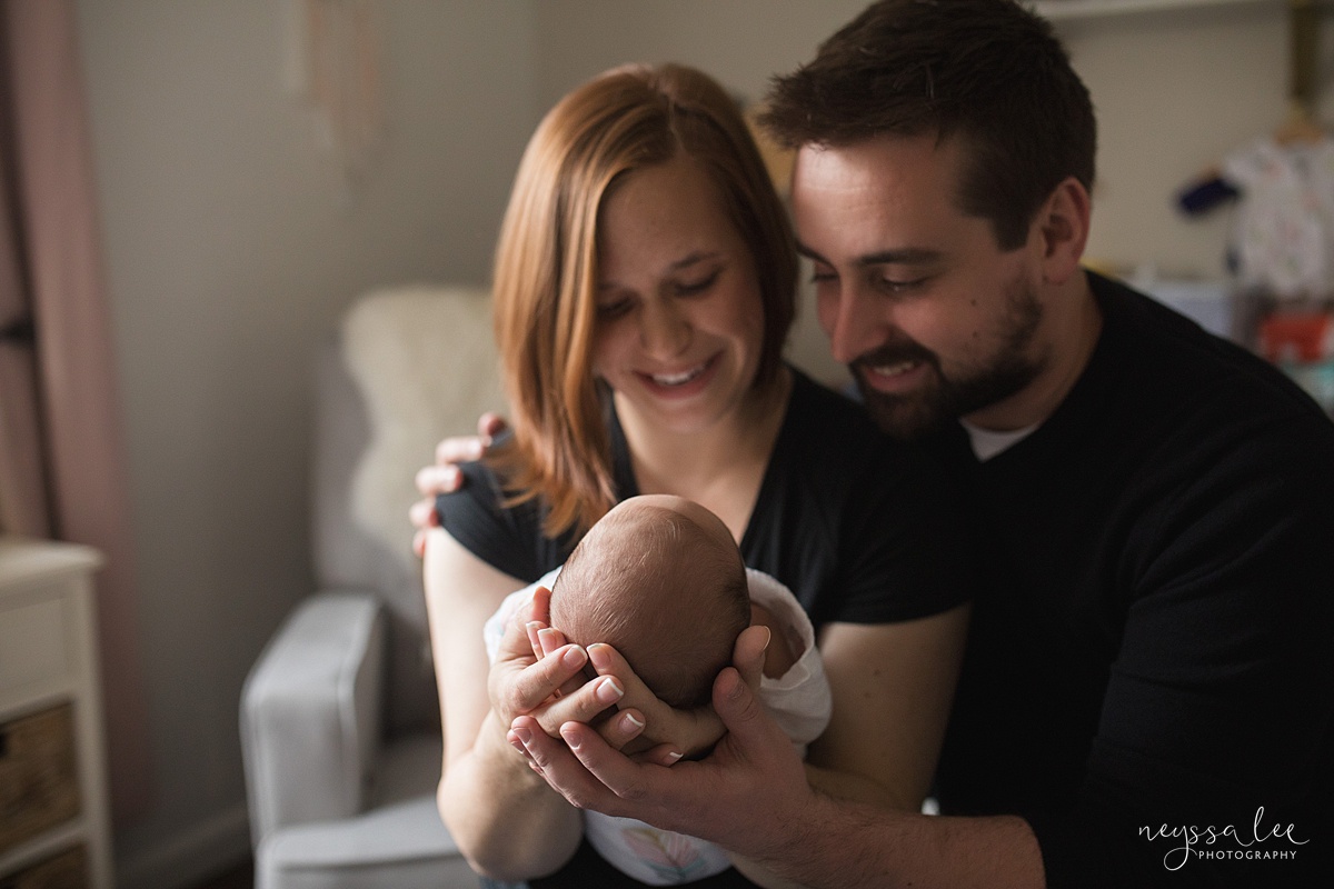 Neyssa Lee Photography, Seattle Newborn Photographer,  Newborn Photo Session Experience, Photo of mom and dad admiring baby girl