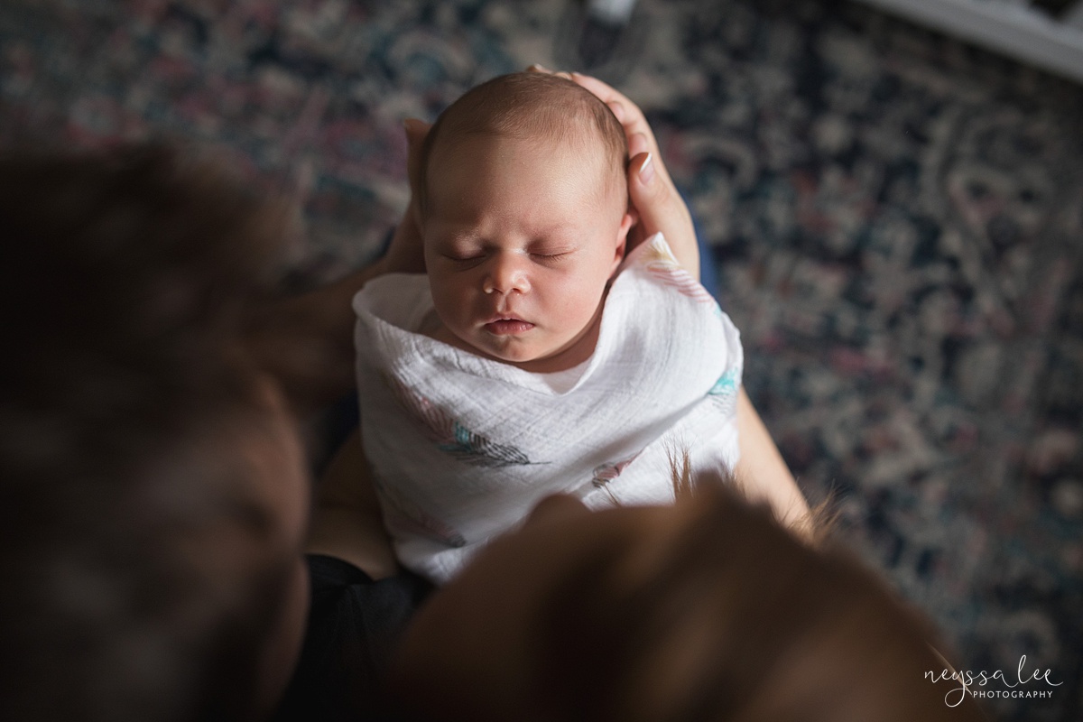 Neyssa Lee Photography, Seattle Newborn Photographer,  Newborn Photo Session Experience, Photo of newborn baby girl from above parents heads