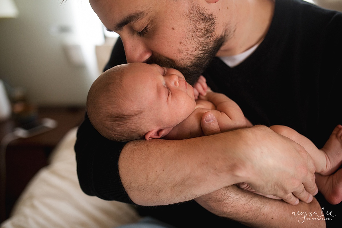 Neyssa Lee Photography, Seattle Newborn Photographer,  Newborn Photo Session Experience, Photo of dad kissing baby girl