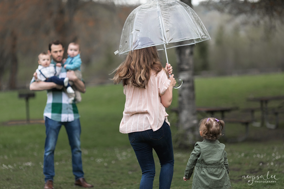 Neyssa Lee Photography, Issaquah Family Photographer, Family Photos with Grey Skies, Lake Sammamish State Park, Photo of mom running with umbrella