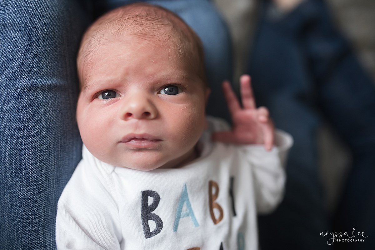 photo of Newborn baby boy looking at camera