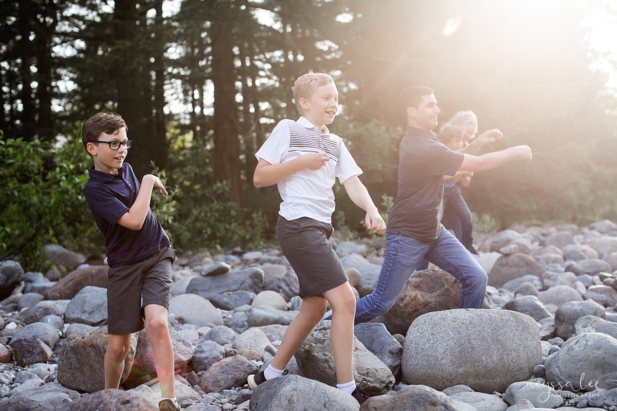 Neyssa Lee Photography, Family Photos with Older Kids, Bellevue Family Photographer, Snoqualmie Family Photography, Family of 5,  Photo of family skipping rocks in beautiful light