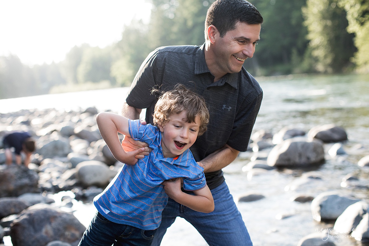 Neyssa Lee Photography, Family Photos with Older Kids, Bellevue Family Photographer, Snoqualmie Family Photography, Family of 5,  playful photo of dad and son by the river