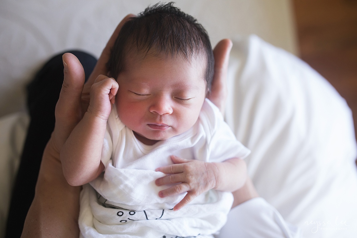 Neyssa Lee Photography, Seattle Newborn Photographer, Bellevue Lifestyle Newborn Photographer,  Photo of newborn baby girl in dad's hands