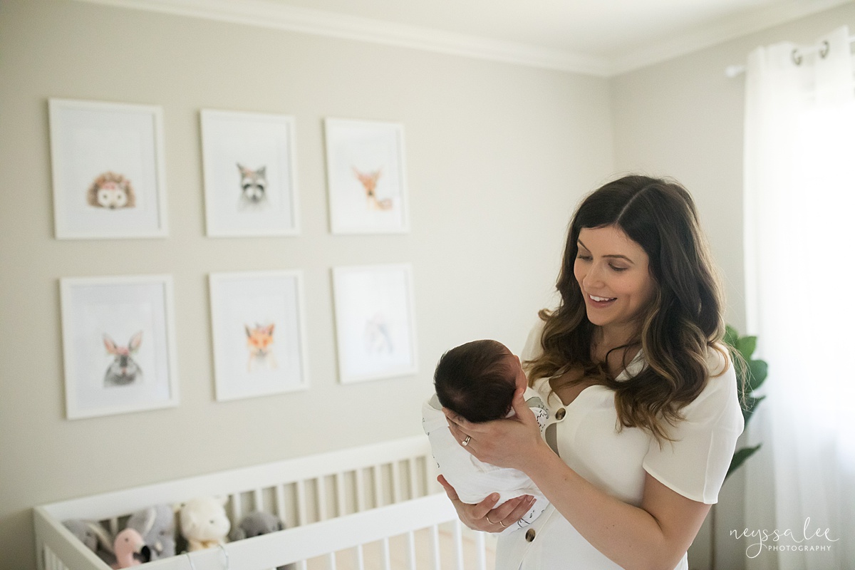 Neyssa Lee Photography, Seattle Newborn Photographer, Bellevue Lifestyle Newborn Photographer,  Photo of mom smiling at newborn baby in nursery