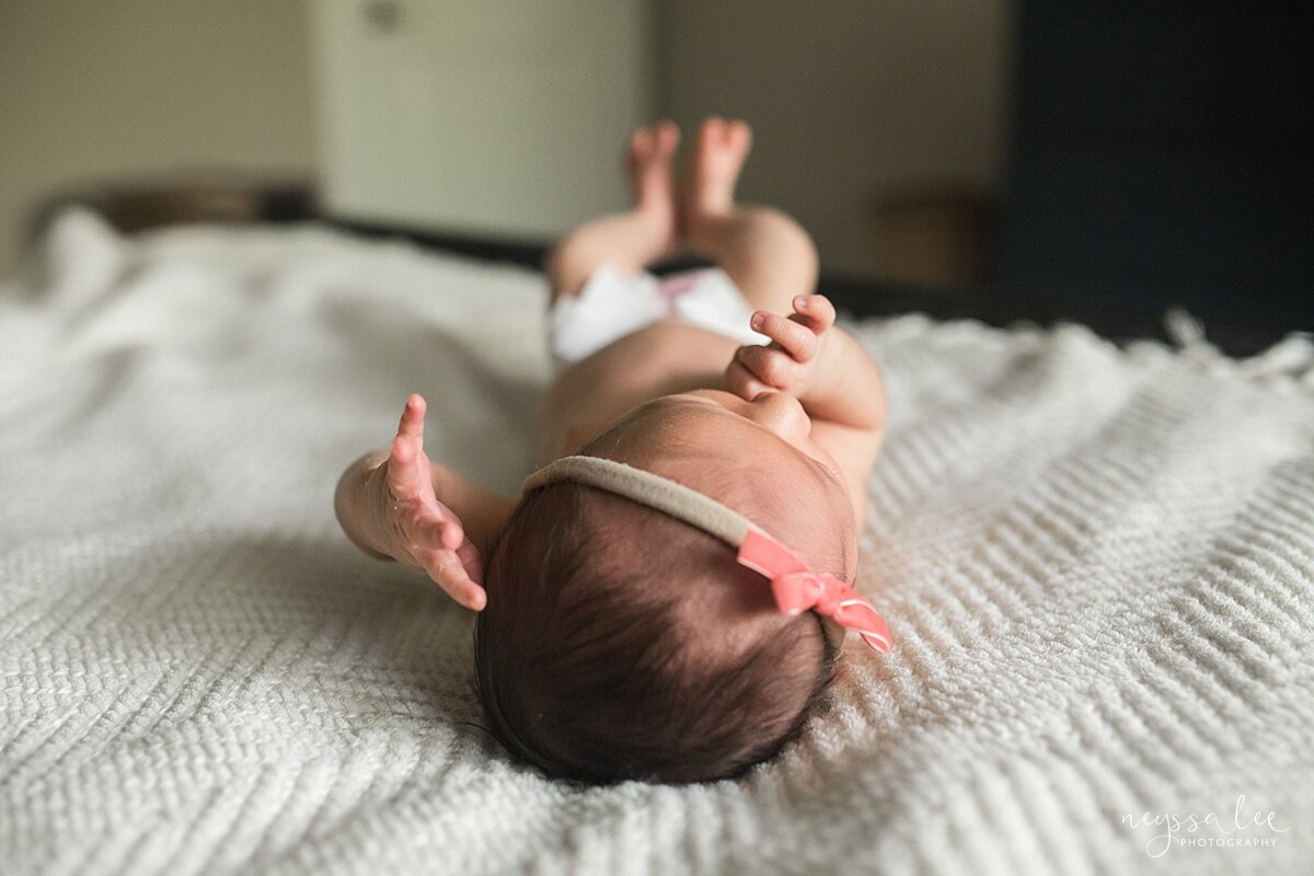 Newborn photo session with a toddler, Issaquah Newborn Photographer, Neyssa Lee Photography, Snoqualmie newborn photography, Lifestyle newborn photo of baby on master bed