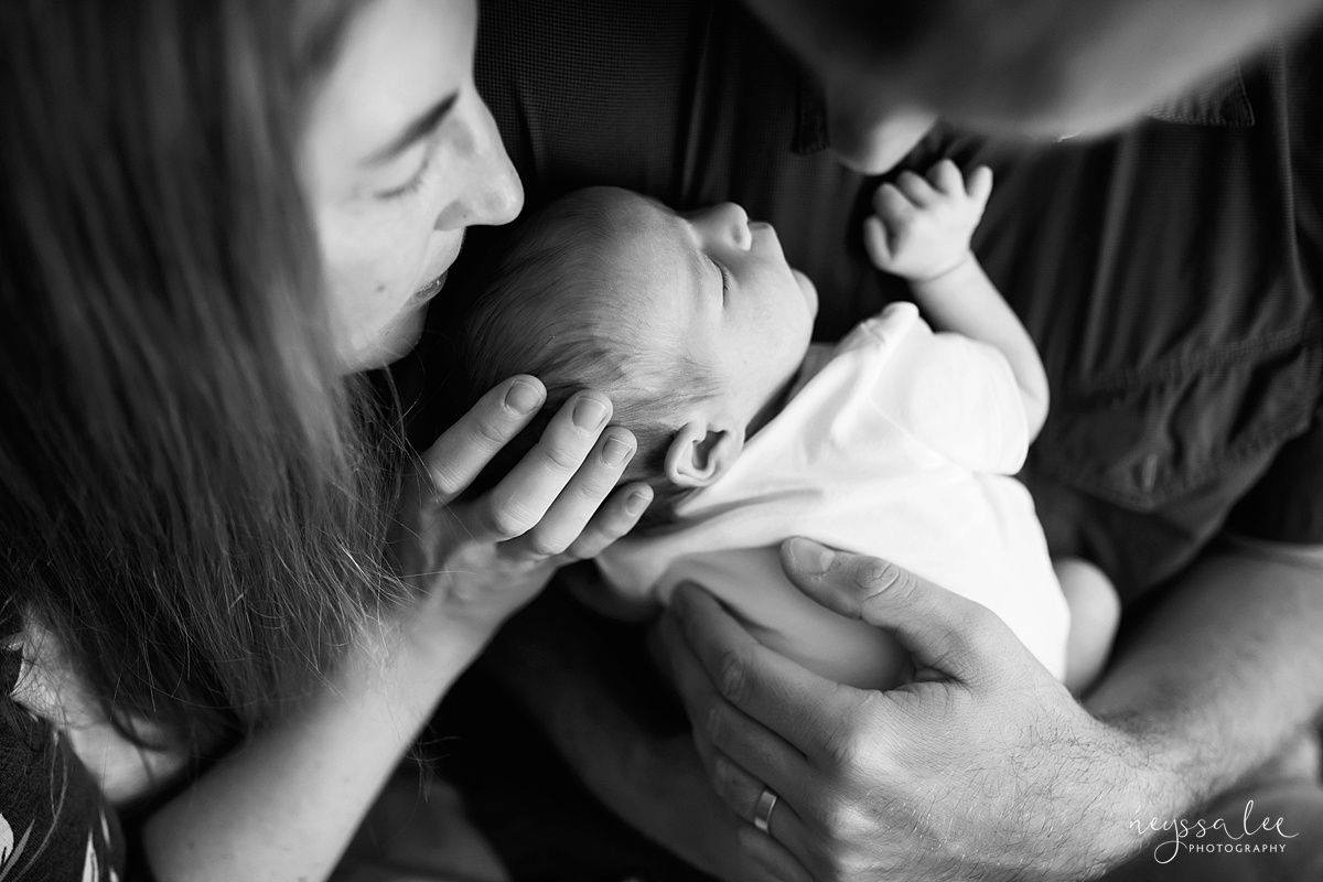  black and white photo of mom loving on newborn baby by Seattle photographer Neyssa Lee