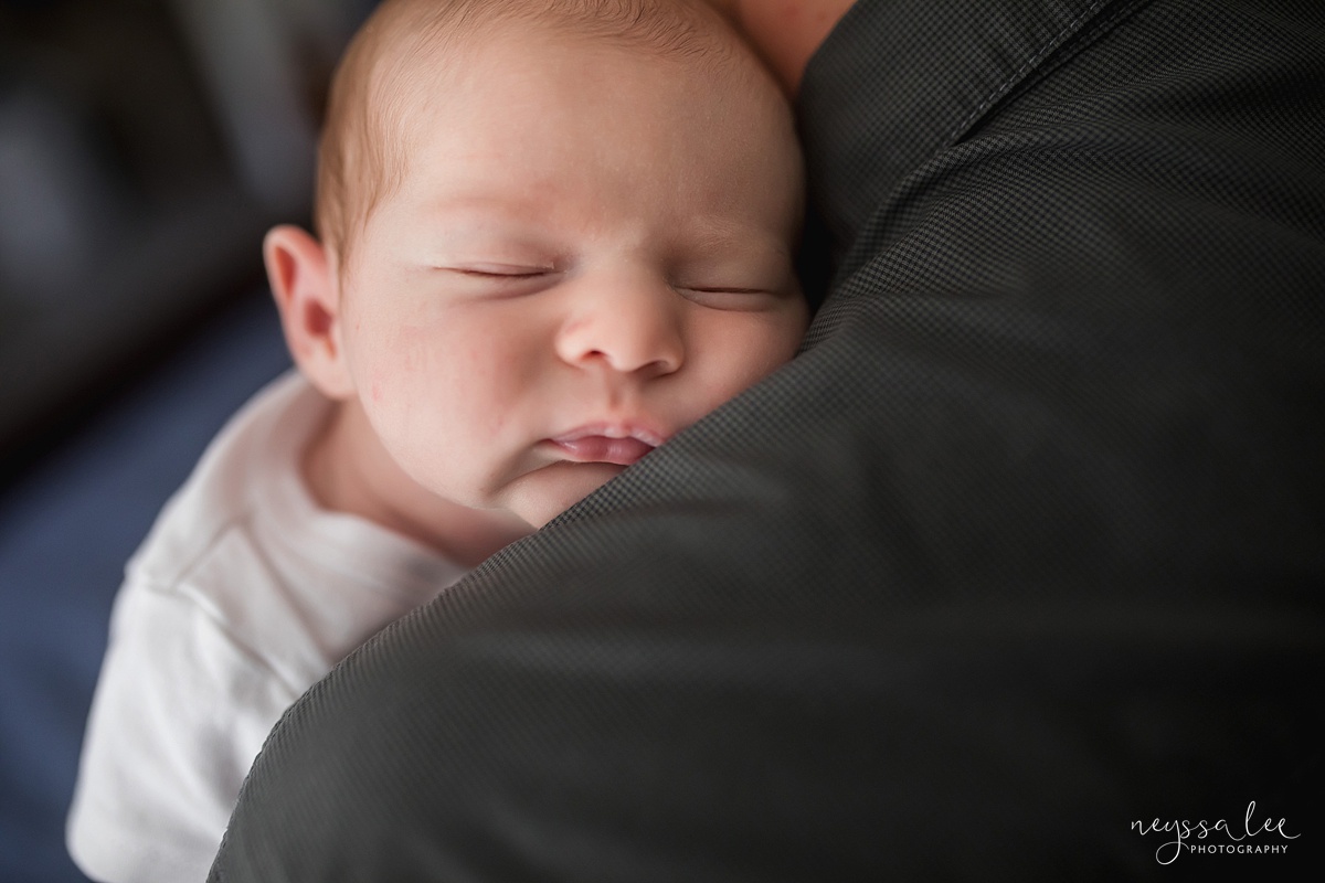 Your Newborn Photo Session Questions Answered, Issaquah Newborn Photographer, Neyssa Lee Photography, Photo of newborn baby asleep on dad's shoulder
