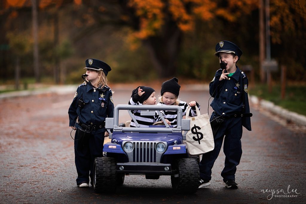 halloween photo tips, kids in cops and robbers halloween costumes