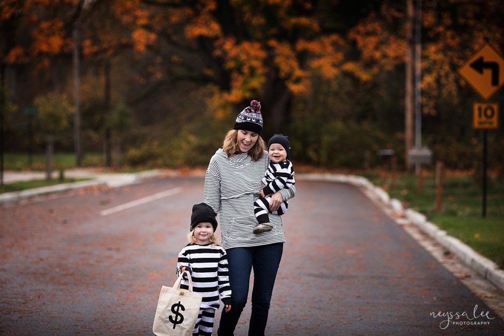 Mother and two kids dressed as robbers in family Halloween Costumes