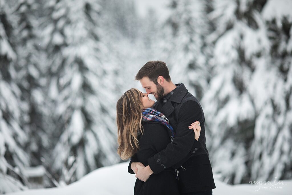 Couple embracing in the snow at Snoqualmie Pass