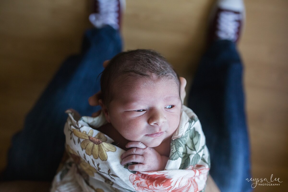 Photo of awake newborn baby girl during Issaquah in hospital newborn session
