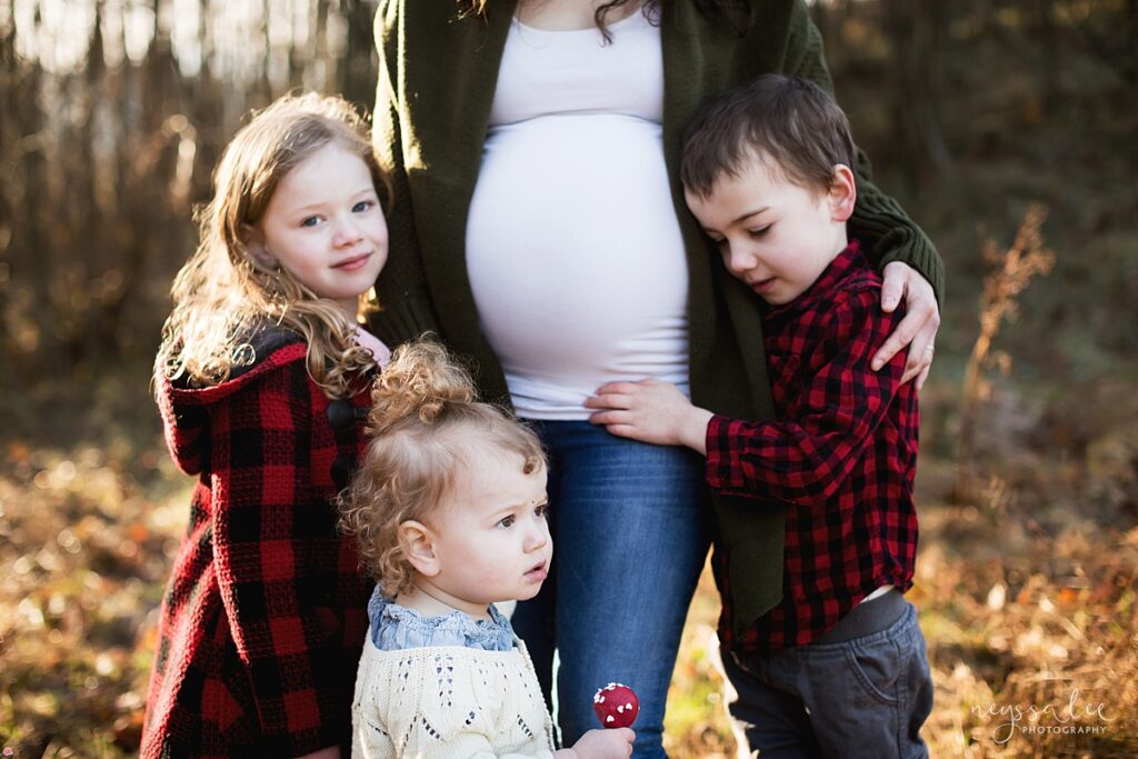 Three siblings hugging moms pregnant belly during Snoqualmie maternity photo session