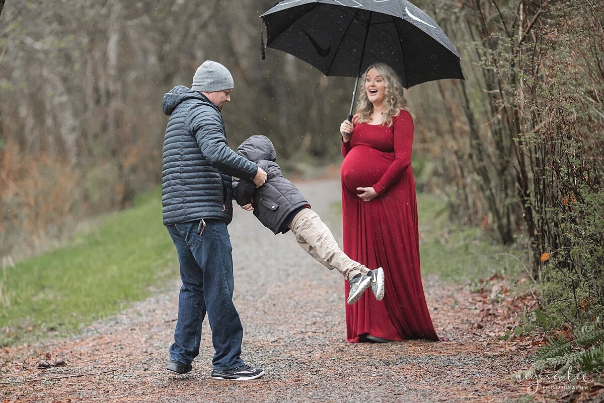 Beautiful Maternity Photos in the Rain, Neyssa Lee Photography, Issaquah maternity photographer,  Photo of father swinging son around while mom watches nearby