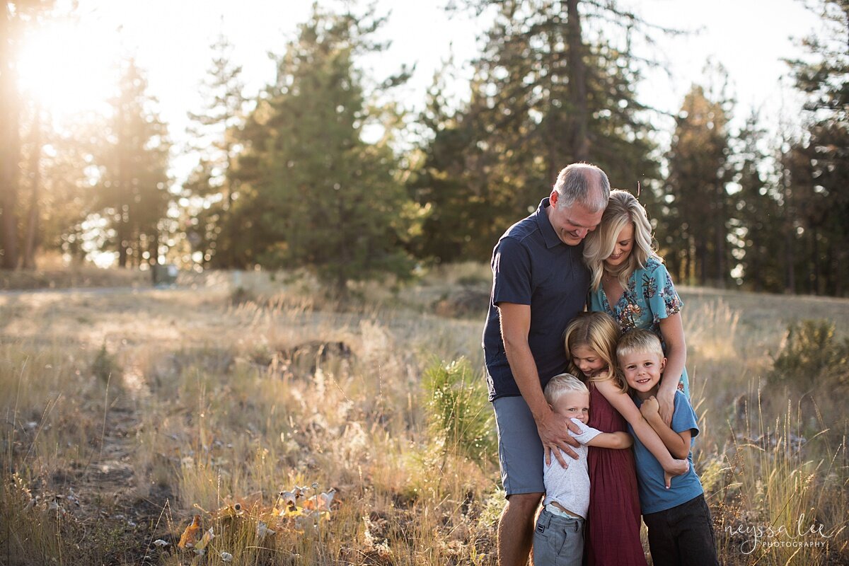 Benefits of family photos on vacation, Neyssa Lee Photography, Chelan Family Photographer, Photo of family in a field at sunset