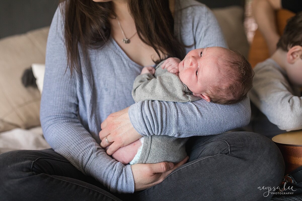 Number One thing you can do for beautiful newborn photos, Issaquah newborn photographer, Neyssa Lee Photography, Lifestyle newborn photo of baby in moms arms