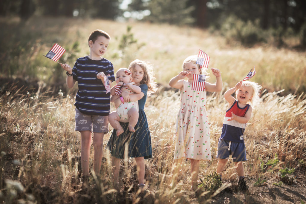 kids waving flags for 4th of July 