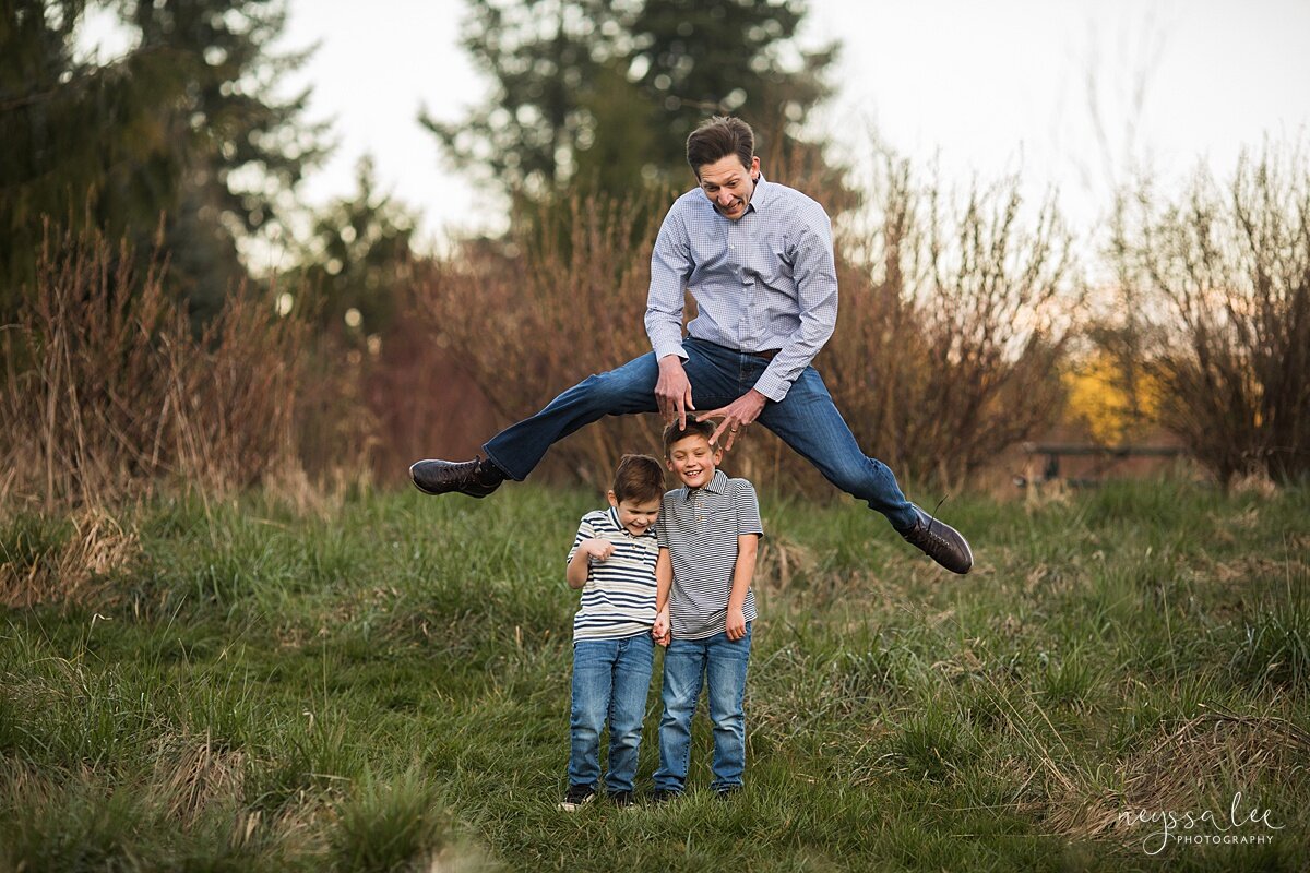 Family Photo Session with Social Distancing, Neyssa Lee Photography, Seattle Family Photographer, Lifestyle family photo of dad jumping over boys