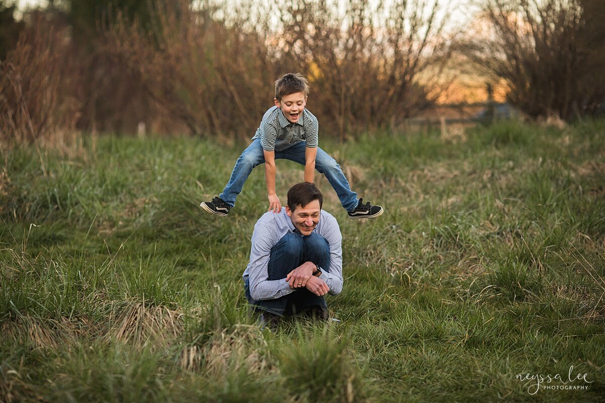 Family Photo Session with Social Distancing, Neyssa Lee Photography, Seattle Family Photographer, Lifestyle family photo of boy jumping over dad