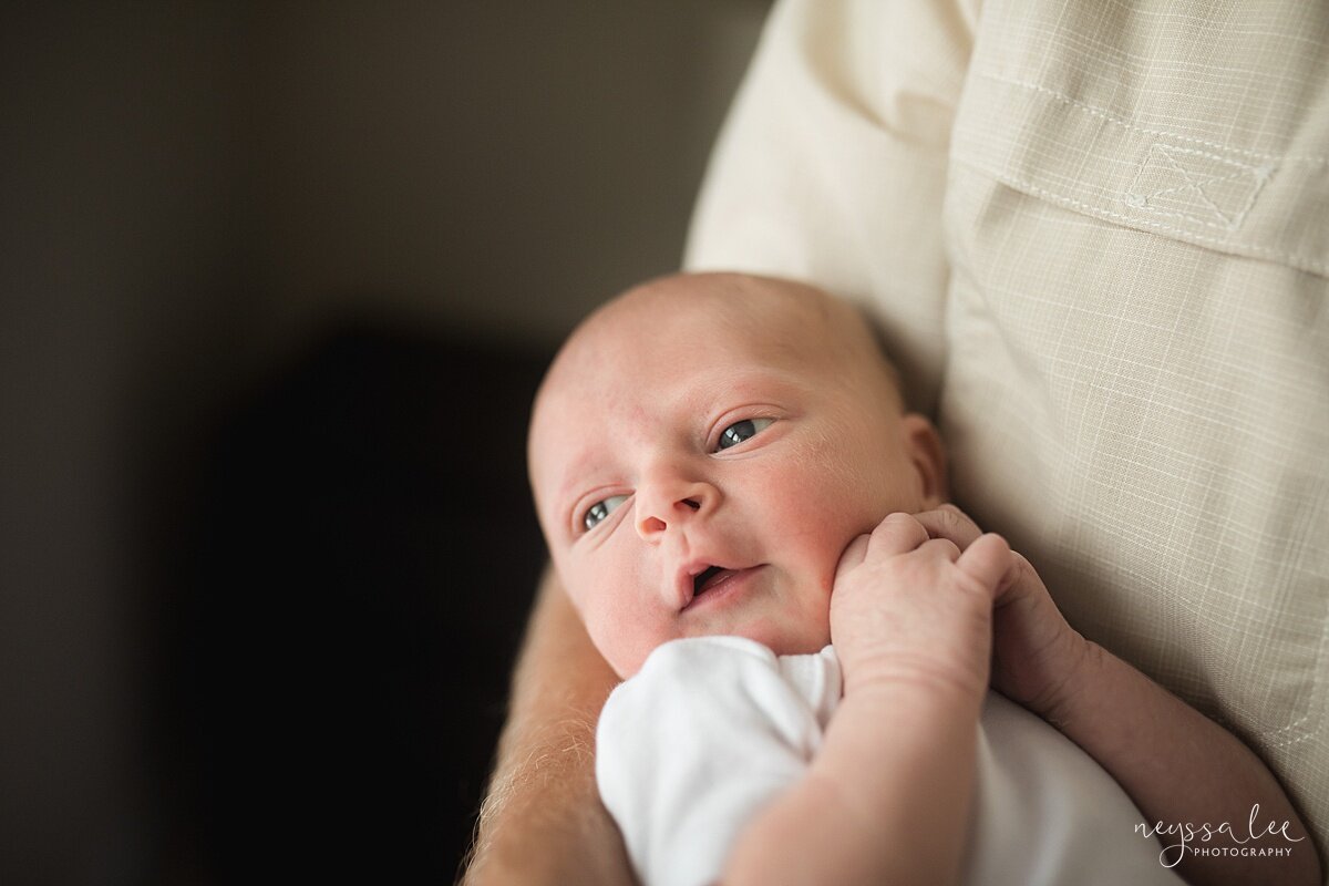 Issaquah photography, Photo of  newborn baby with hands by his face