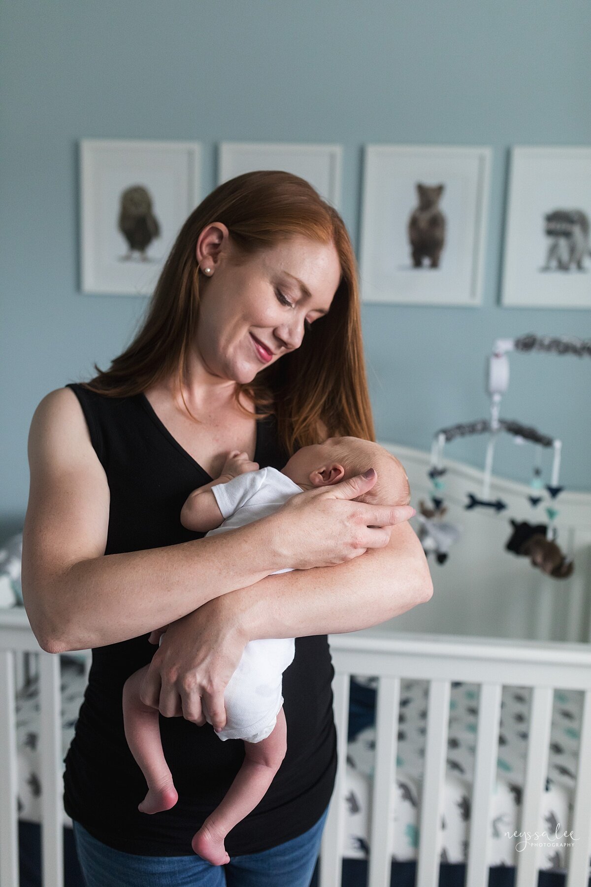  Photo of mom with baby in nursery  by Seattle Photographer