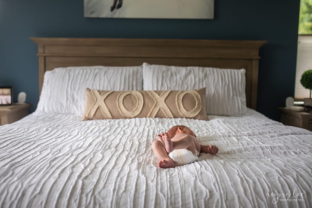 photo of newborn baby on bed, newborn feet, snoqualmie newborn photography