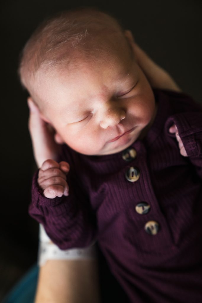 newborn in a purple gown by Loulou and Company