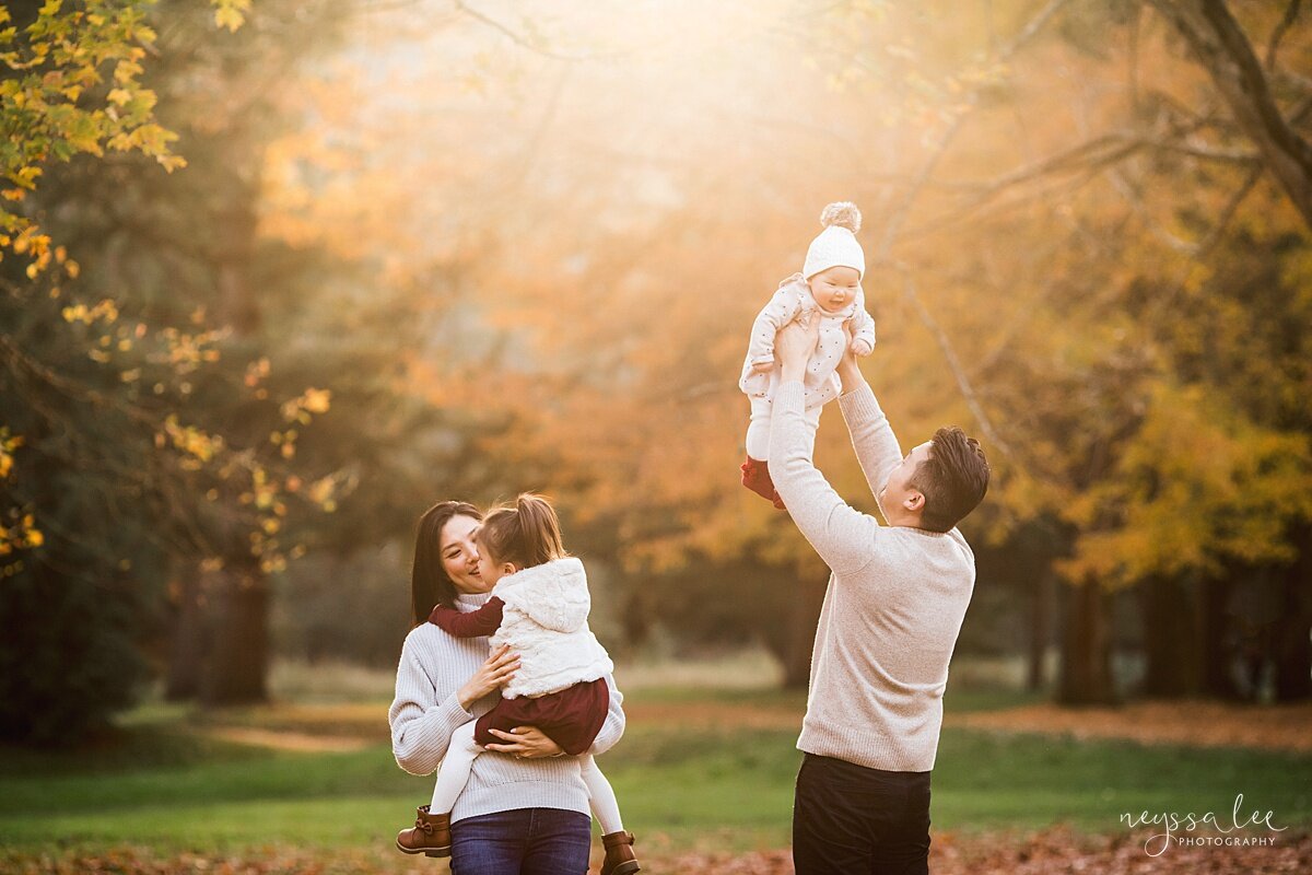 3 Tips for Keeping Baby Warm for Family Photos, Neyssa Lee Photography, Seattle Fall Family Photos, Photo of family playing with fall color in background 