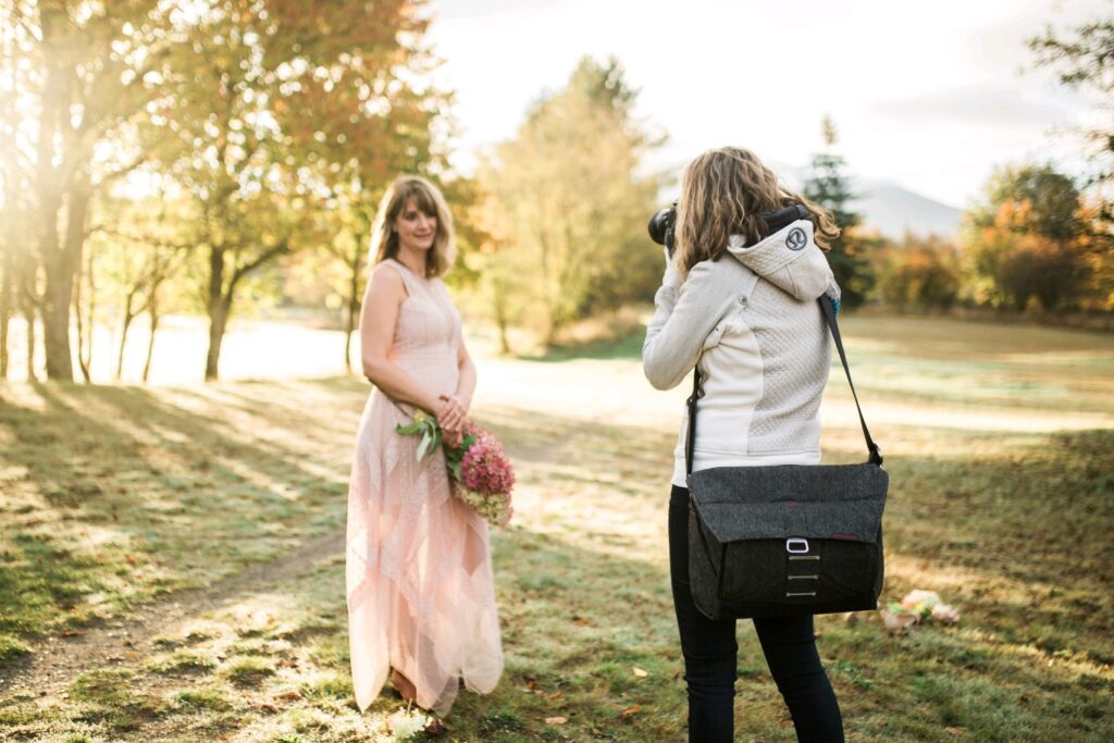 Seattle photographer taking branding photo while wearing a peak design camera bag