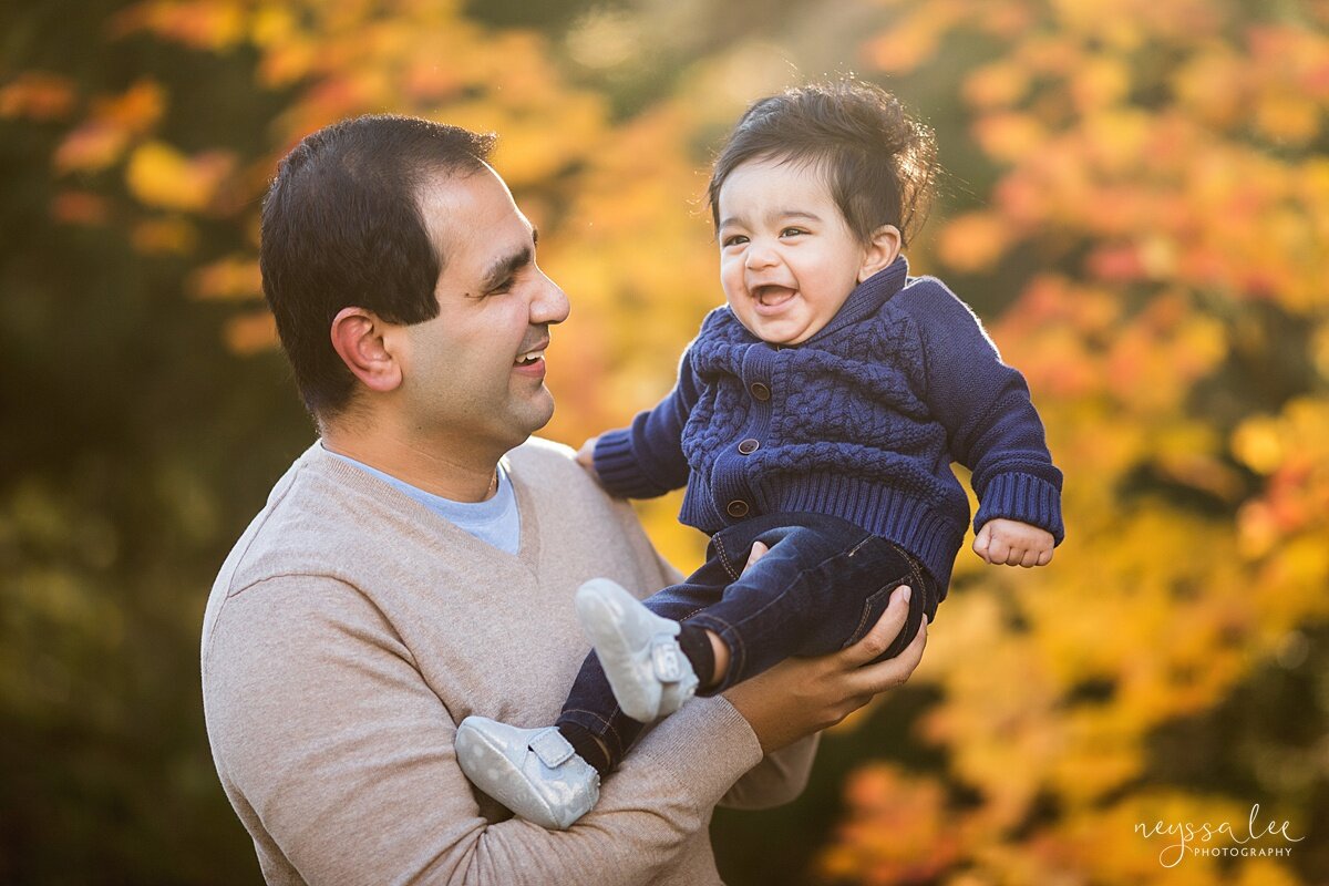 Playful photo of father and 6 Month baby boy during Snoqualmie family pictures
