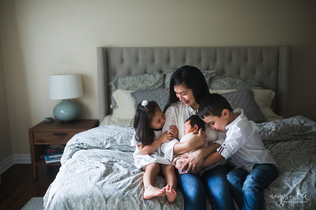 Mother and three children during a Bellevue, Wa in-home newborn portrait session