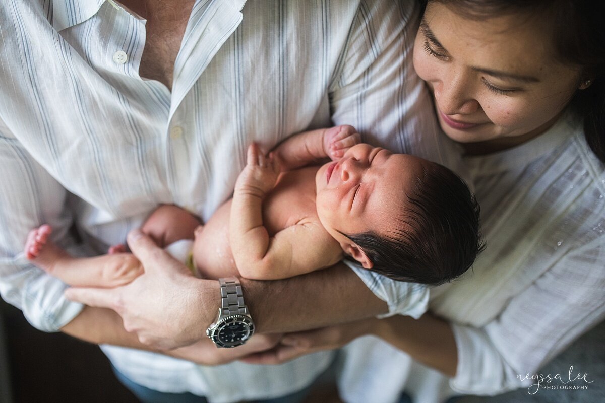 How to prepare for newborn photos, Neyssa Lee Photography, Seattle newborn photographer, Team Green Tips, Photo of parents loving newborn baby