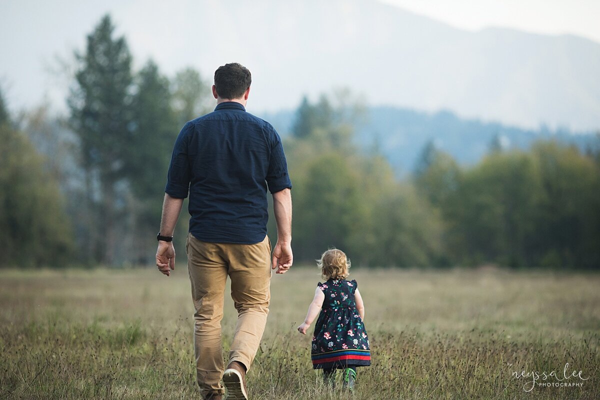 Best time of day for outdoor family photos, Seattle family photographer Photo of father and son walking in field