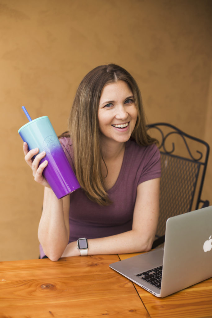 Photography business growth coach Neyssa Lee with iced tea and laptop